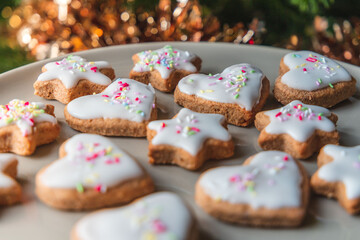 Christmas biscuits with a Christmas tree and snowman. White iced Christmas cookies in different sizes and shapes