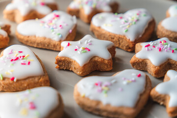 Christmas biscuits with a Christmas tree and snowman. White iced Christmas cookies in different sizes and shapes