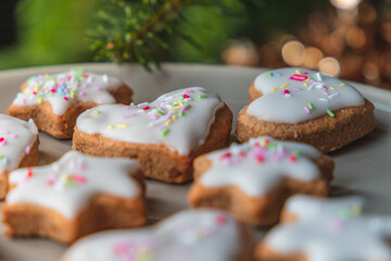 Christmas biscuits with a Christmas tree and snowman. White iced Christmas cookies in different sizes and shapes