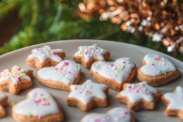 Christmas biscuits with a Christmas tree and snowman. White iced Christmas cookies in different sizes and shapes