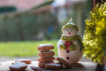 Christmas biscuits with a Christmas tree and snowman. White iced Christmas cookies in different sizes and shapes