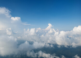 Aerial view clouds and blue sky from airplane window