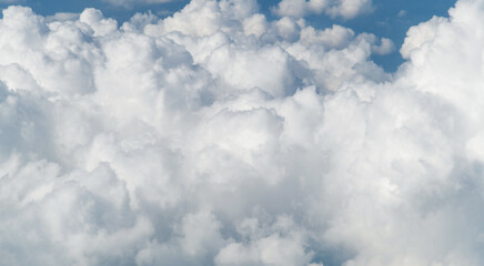 Aerial view on white fluffy clouds