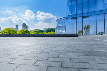 Panoramic skyline and modern commercial buildings with empty square floor in Shanghai, China.