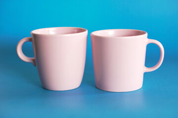 ceramic coffee cup on blue background, mug