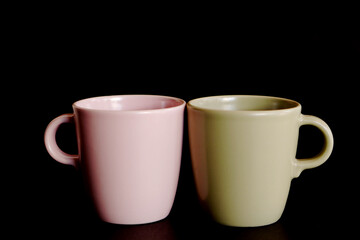 two cups of coffee on lack background