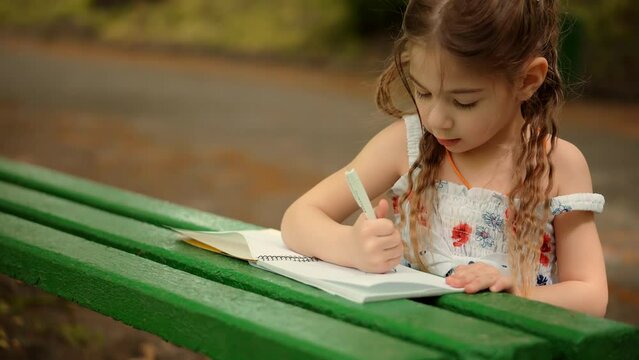 happy girl playing. happy little child girl drawing picture