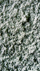 rough texture of paint applied to the wall. abstract texture. Vertical image.