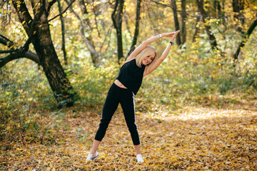 young girl walking in autumn park