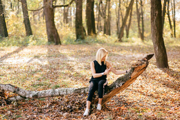 young girl walking in autumn park