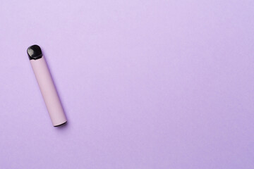 Disposable electronic cigarette on color background, top view