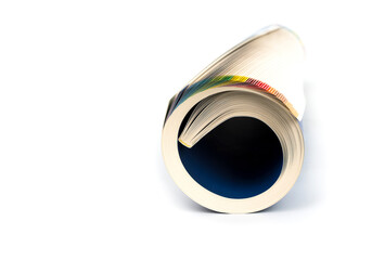 Rolled up magazines on a white background