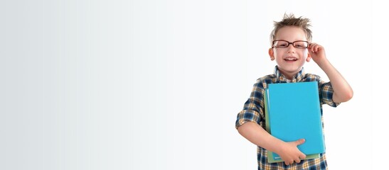 Young happy school child posing