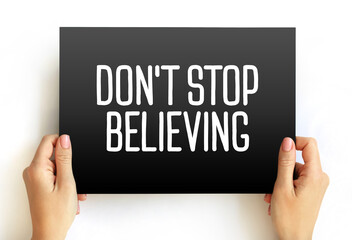 Don't Stop Believing text quote on card, concept background