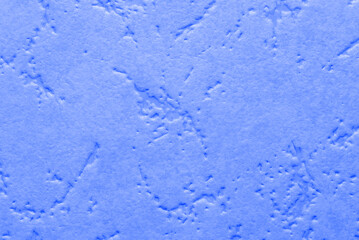 The texture with small patterns of blue. Closeup