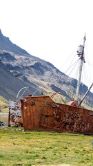 Old, rusted whaling and sealing ship at the old whaling station at Grytviken, South Georgia Island - obrazy, fototapety, plakaty