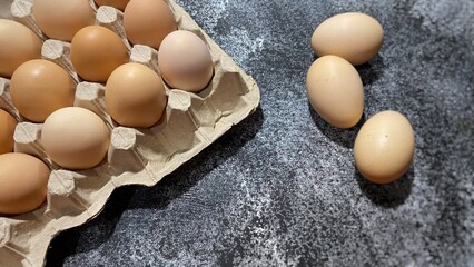 yellow chicken eggs lie on the table