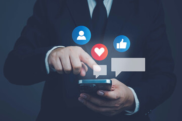 Social media and digital online concept, businessman using smart phone. The concept of living on vacation and playing social media. Social Distancing ,Working From Home concept.