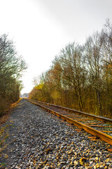 Train tracks through nature to infinity in Germany.