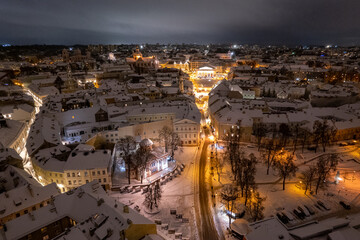 Aerial winter snowy night view of Vilnius old town, Lithuania