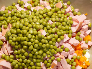 The Olivier salad is already sliced. Closeup. Top view