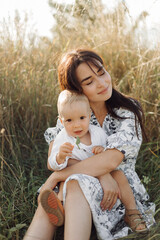 Fototapeta premium Happy young family spend time together outside in green nature