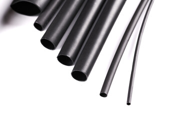 Black wire insulation material, Polyvinylchloride, Polyethylene, Rubber isolated on white background