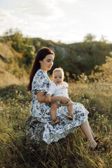 Fototapeta premium Happy young family spend time together outside in green nature