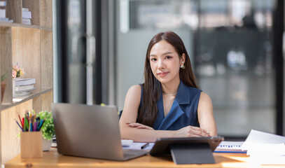 Fototapeta premium Portrait of business asian woman Accounting using calculating income-expenditure and analyzing real estate investment data report Financial and tax systems concept. 