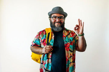 Bearded man in hawaiian shirt and backpack