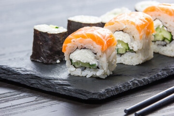 Philadelphia roll sushi with salmon, prawn, avocado, cream cheese. Sushi menu. Japanese food.