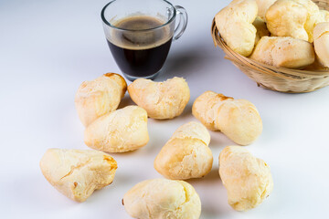 Brazilian Pão de queijo, fresh cheese breads and a hot cup of coffee. Selective focus