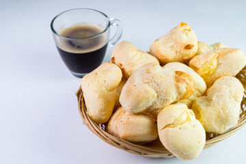 Brazilian Pão de queijo, fresh cheese breads and a hot cup of coffee. Selective focus