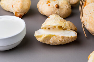 Brazilian Pão de queijo, fresh cheese bread stuffed with catupiry and cream cheese. Selective focus