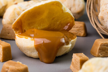 Brazilian Pão de queijo, fresh cheese bread stuffed with dulce de leche. Selective focus