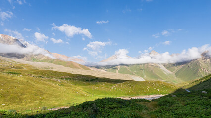 mountain peaks in the clouds. low clouds in the mountains