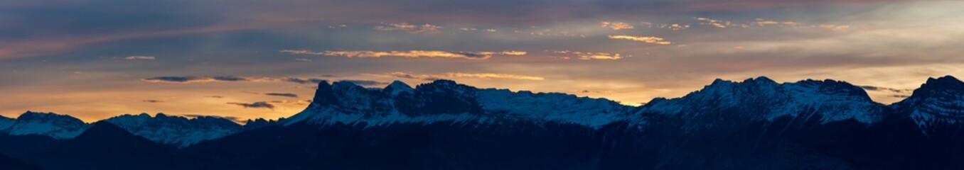 Uriage les Bains, Isère, Rhône-Alpes, France, 27 11 2022 magnificent sunset over the snowy mountains, blue yellow pink purple sky, cold colors sky