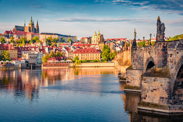 Exciting spring cityscape Prague with Charles Bridge and Castle and St. Vitus cathedral on the...