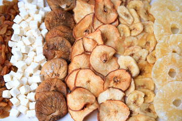 Different tasty dried fruits as background, closeup