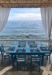 table and chairs on the beach
