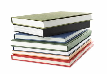 Many different books stacked on white background