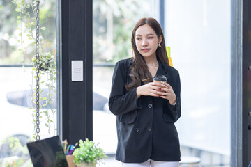 Portrait of Happy Beautiful Business Asian Woman in Office