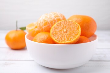 Fresh juicy tangerines on white wooden table, closeup