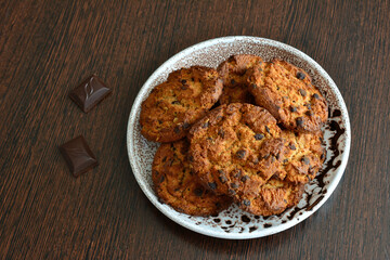 american cookies with chocolate chips isolated on plate, close-up