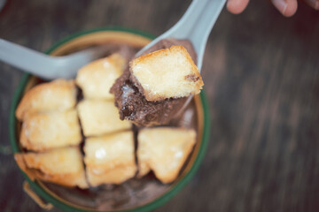 Pang yen cube bread in ice crystals with syrup and milk is a sweet dessert in Thailand. Close up