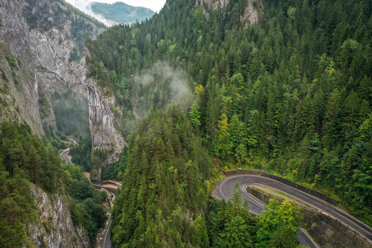 Bicaz pass mountain road high up in the Carpathian Mountains in Romania on a foggy autumn day