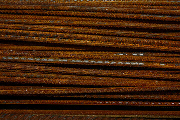 Metal rusty reinforcement bars. Background building rusty fittings on the construction site