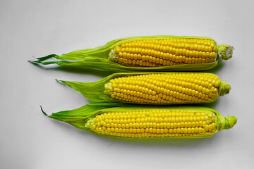 3  Fresh corns. Clipping path. Three cob isolated on a white background