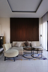 Living room interior with
industrial, with cream sofas and glass tables.