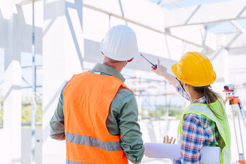 Engineer builder architect team working check roof beam construction progress structure building.